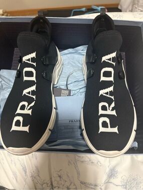Prada womens Black Logo Knit Slip-On Sneakers